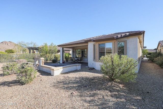 back of house with a patio area