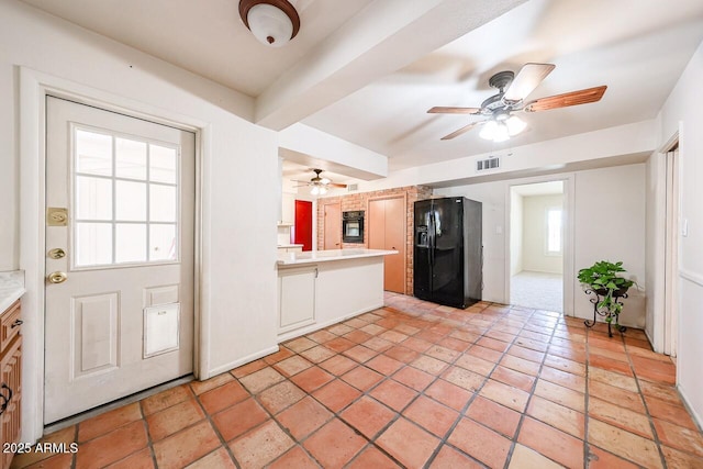 519 N Redondo Dr N, Litchfield Park, AZ 85340 - kitchen with black appliances, a ceiling fan, plenty of natural light, and light countertops