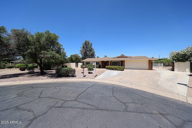 519 N Redondo Dr N, Litchfield Park, AZ 85340 - ranch-style home featuring a garage and concrete driveway