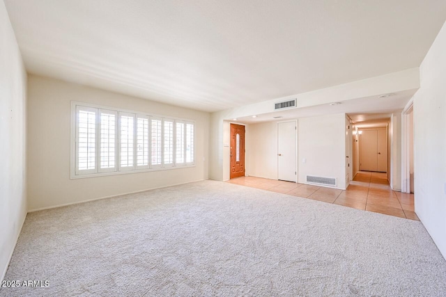 519 N Redondo Dr N, Litchfield Park, AZ 85340 - empty room featuring light colored carpet and light tile patterned floors