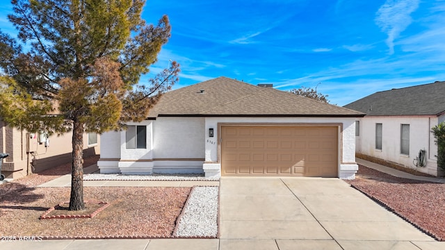 ranch-style house featuring driveway, a shingled roof, an attached garage, and stucco siding