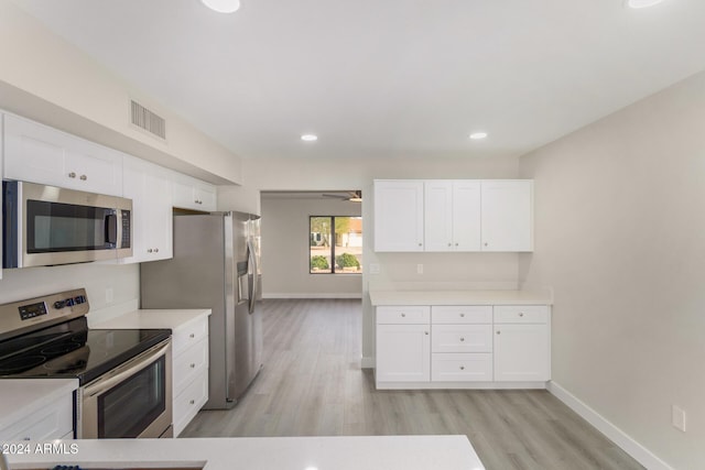 kitchen featuring white cabinets, ceiling fan, light hardwood / wood-style floors, and stainless steel appliances