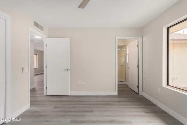 unfurnished bedroom featuring light hardwood / wood-style flooring and ceiling fan