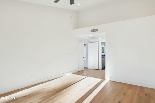 spare room with ceiling fan and light hardwood / wood-style flooring