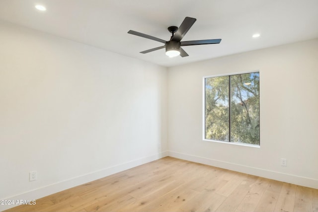 empty room featuring ceiling fan and light wood-type flooring