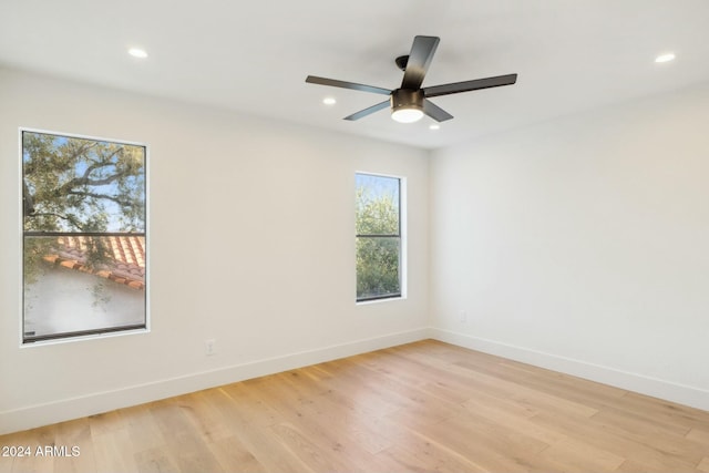 unfurnished room featuring light hardwood / wood-style flooring and ceiling fan