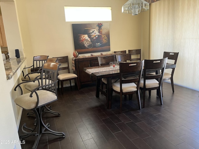 dining area featuring an inviting chandelier