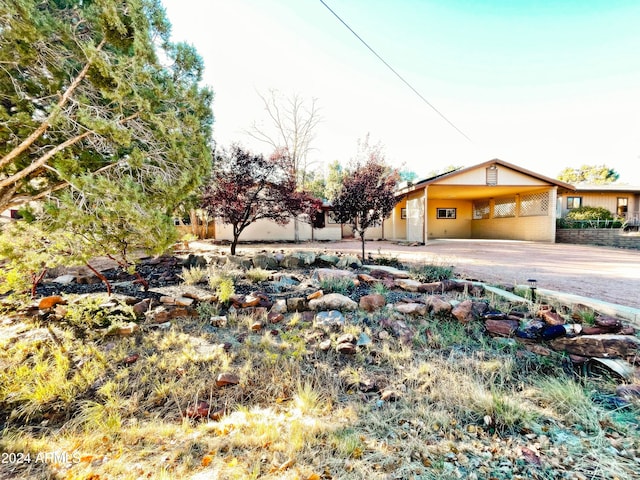 exterior space with a carport