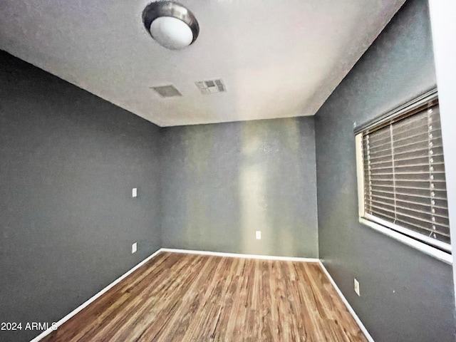 empty room featuring hardwood / wood-style floors