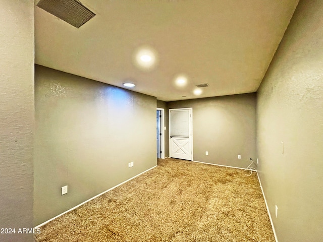 empty room featuring carpet flooring