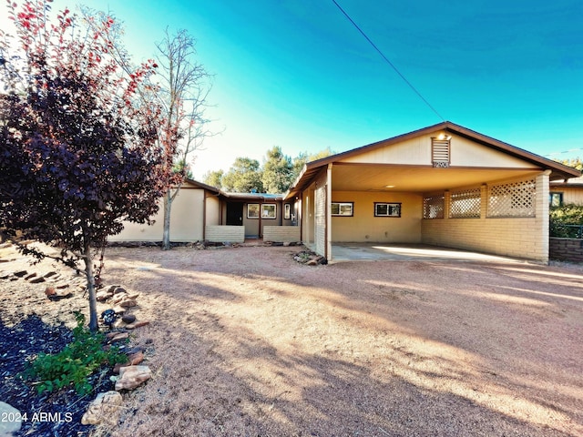 view of side of property with a carport