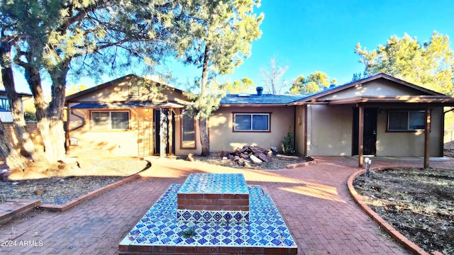 back of property featuring a patio