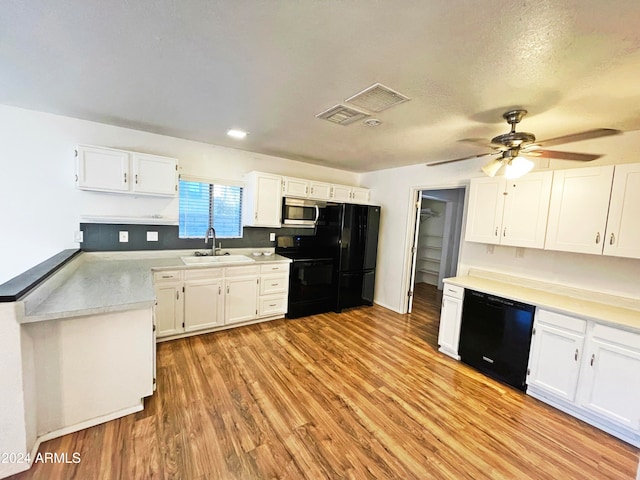 kitchen featuring white cabinetry, sink, ceiling fan, light hardwood / wood-style flooring, and black appliances