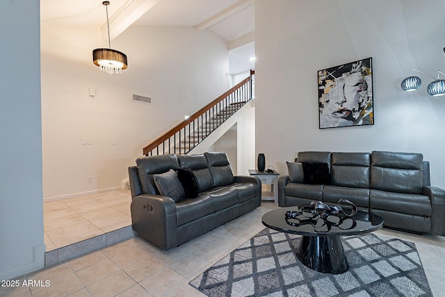 6216 W Poinsettia Dr, Glendale, AZ 85304 - living area featuring stairway, light tile patterned floors, beamed ceiling, high vaulted ceiling, and baseboards