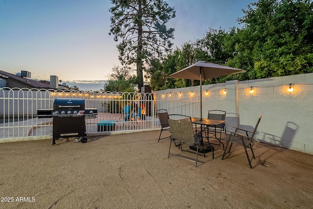 6216 W Poinsettia Dr, Glendale, AZ 85304 - patio terrace at dusk featuring fence and a grill