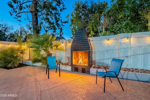 6216 W Poinsettia Dr, Glendale, AZ 85304 - view of patio featuring an outdoor brick fireplace and fence