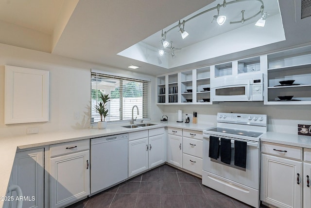 6216 W Poinsettia Dr, Glendale, AZ 85304 - kitchen featuring white appliances, a sink, open shelves, dark tile patterned floors, and white cabinetry