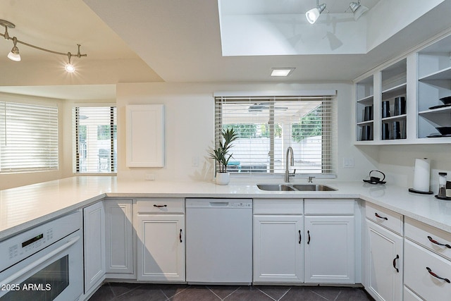 6216 W Poinsettia Dr, Glendale, AZ 85304 - kitchen featuring white appliances, a sink, track lighting, open shelves, and light countertops