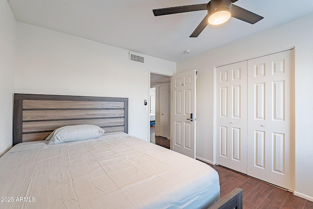 6216 W Poinsettia Dr, Glendale, AZ 85304 - bedroom with dark wood-style flooring, a closet, ceiling fan, and baseboards
