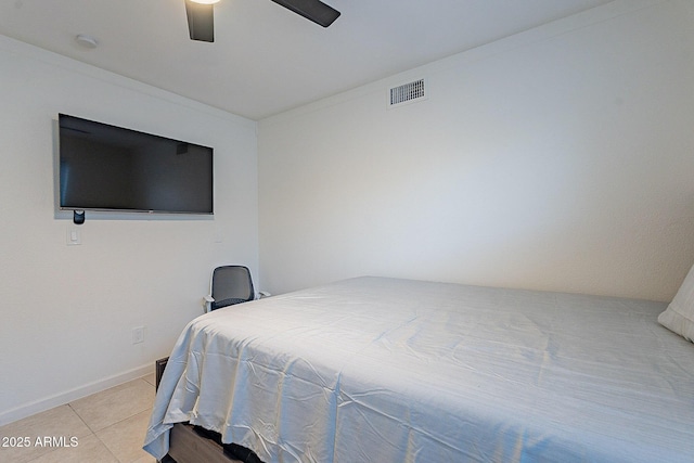 6216 W Poinsettia Dr, Glendale, AZ 85304 - bedroom with light tile patterned floors, a ceiling fan, and baseboards