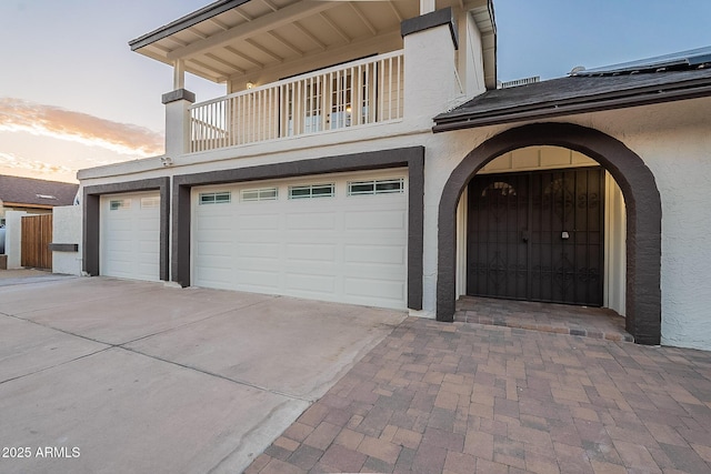 6216 W Poinsettia Dr, Glendale, AZ 85304 - garage at dusk featuring concrete driveway