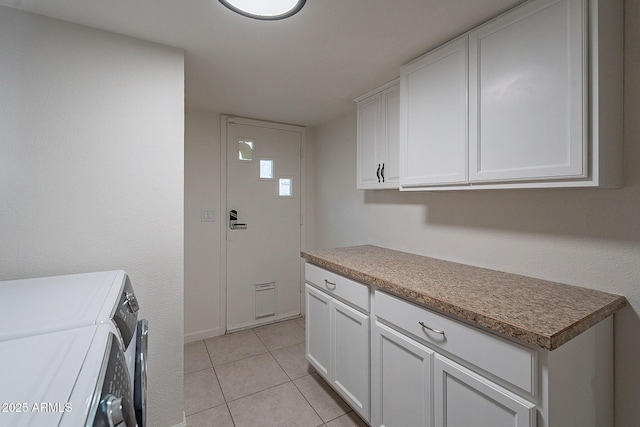 6216 W Poinsettia Dr, Glendale, AZ 85304 - washroom featuring separate washer and dryer, cabinet space, and light tile patterned flooring