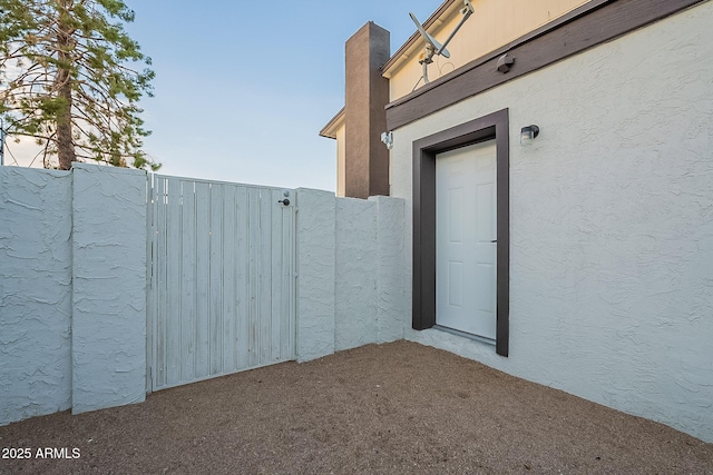6216 W Poinsettia Dr, Glendale, AZ 85304 - doorway to property featuring a gate and stucco siding