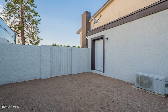 6216 W Poinsettia Dr, Glendale, AZ 85304 - doorway to property featuring a cooling unit, stucco siding, fence, and a gate