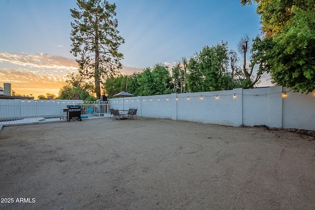 6216 W Poinsettia Dr, Glendale, AZ 85304 - yard at dusk featuring fence and a patio