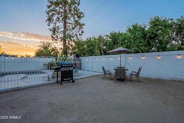 6216 W Poinsettia Dr, Glendale, AZ 85304 - view of patio featuring fence, a grill, and outdoor dining space