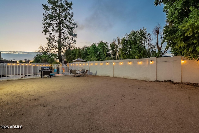 6216 W Poinsettia Dr, Glendale, AZ 85304 - yard at dusk with a fenced backyard