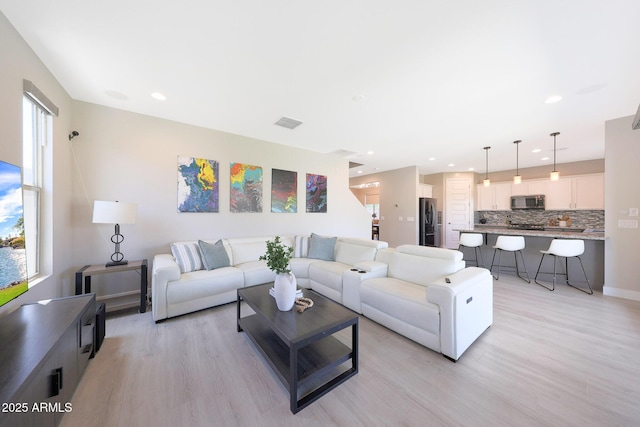 9750 E Radioactive Dr, Mesa, AZ 85212 - living area with light wood-style flooring, recessed lighting, and baseboards
