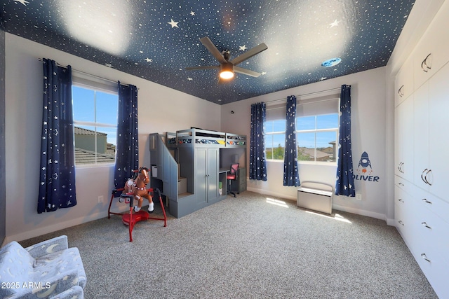 9750 E Radioactive Dr, Mesa, AZ 85212 - carpeted bedroom with baseboards and ceiling fan