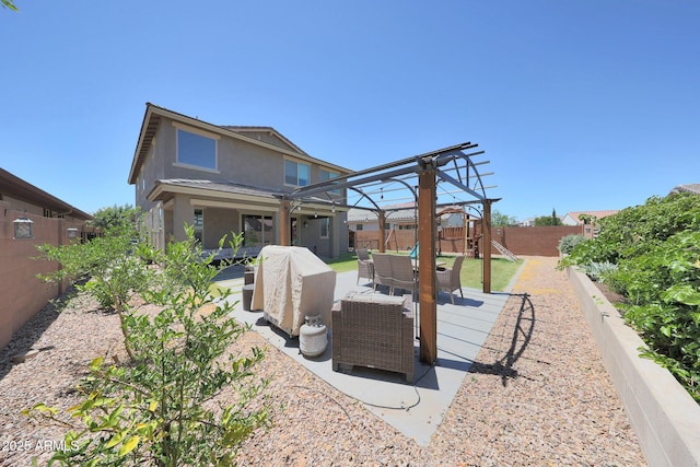 9750 E Radioactive Dr, Mesa, AZ 85212 - rear view of house with outdoor lounge area, a playground, a fenced backyard, stucco siding, and a patio area