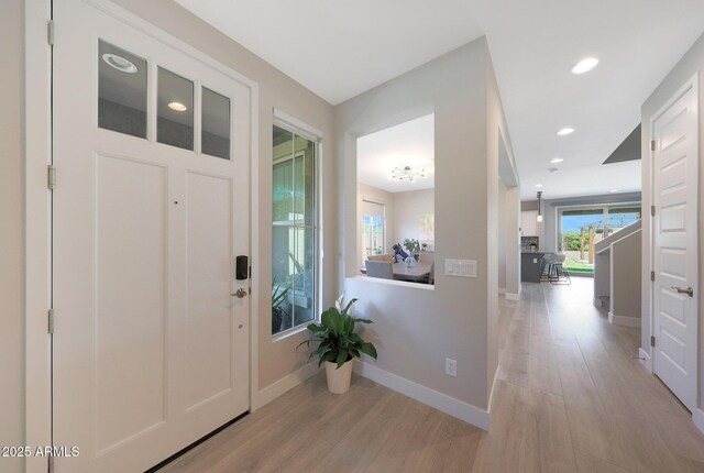 9750 E Radioactive Dr, Mesa, AZ 85212 - foyer entrance featuring light wood-type flooring, baseboards, and recessed lighting