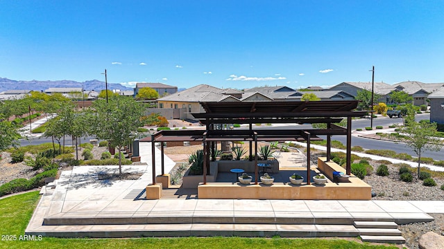 9750 E Radioactive Dr, Mesa, AZ 85212 - view of patio featuring a pergola, a residential view, and a mountain view