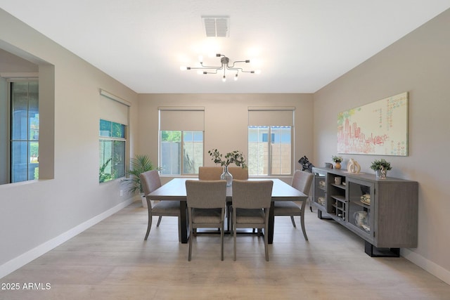 9750 E Radioactive Dr, Mesa, AZ 85212 - dining room featuring baseboards, a chandelier, and light wood finished floors