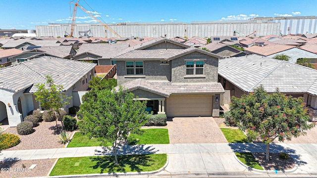 9750 E Radioactive Dr, Mesa, AZ 85212 - view of front of house featuring stucco siding, driveway, a tile roof, an attached garage, and a residential view