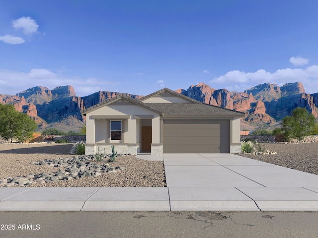ranch-style house with stucco siding, a garage, driveway, a mountain view, and stone siding