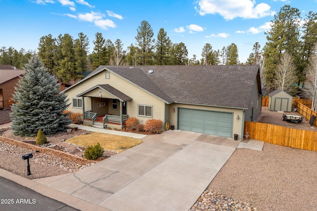 ranch-style home featuring fence, driveway, roof with shingles, a porch, and an attached garage