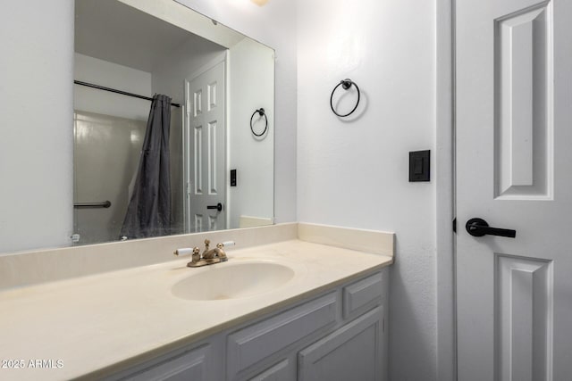 bathroom featuring vanity and a shower with shower curtain