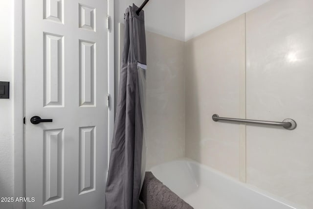 bathroom with shower / bath combination with curtain