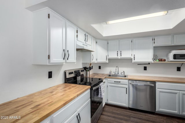 kitchen featuring white cabinetry and appliances with stainless steel finishes