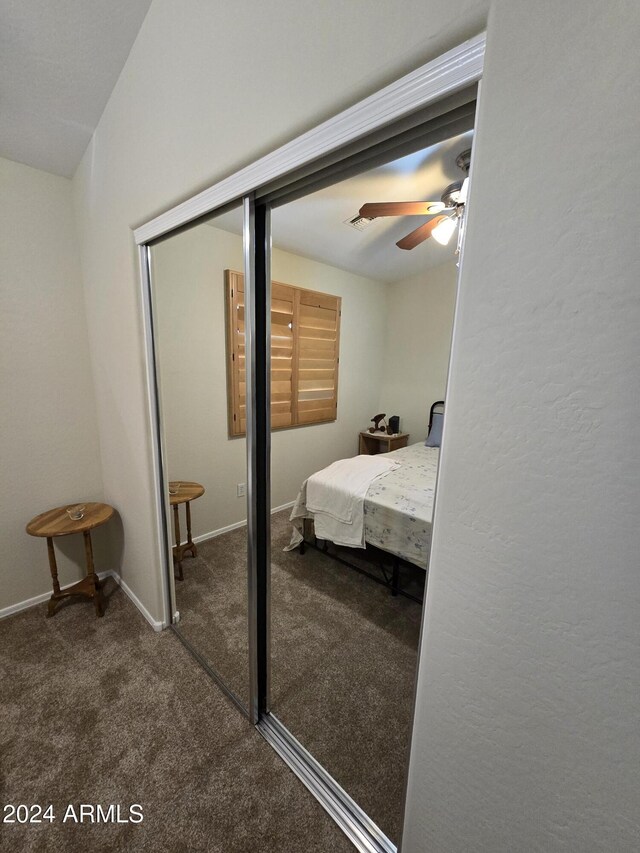 bedroom with ceiling fan and carpet floors