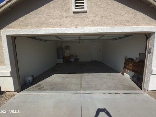 garage featuring water heater