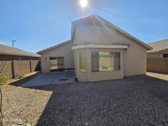 back of property with a patio area