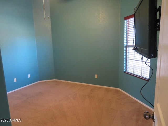 unfurnished room featuring carpet flooring