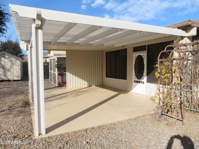 view of patio / terrace featuring a storage unit