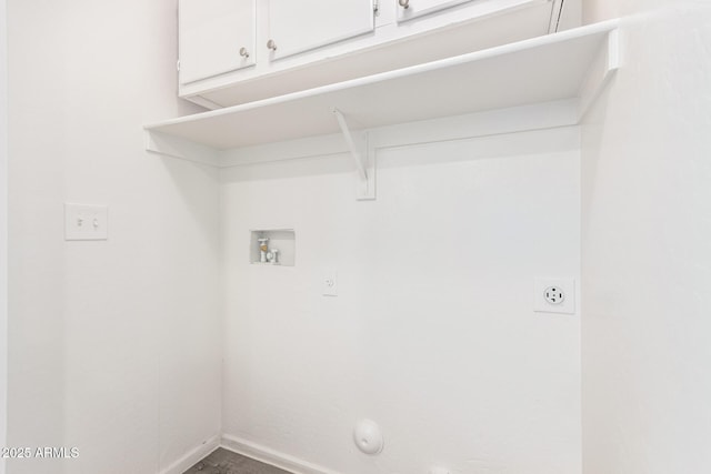 washroom featuring baseboards, cabinet space, gas dryer hookup, and washer hookup