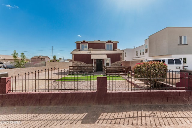 view of front of home with stucco siding and fence